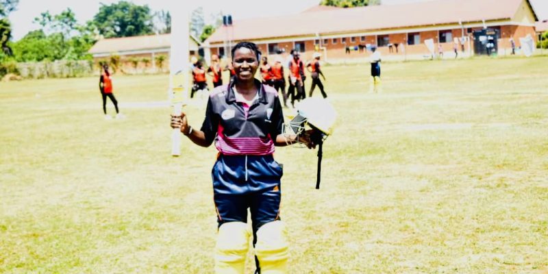 Illoku Esther takes a pose after scoring a century