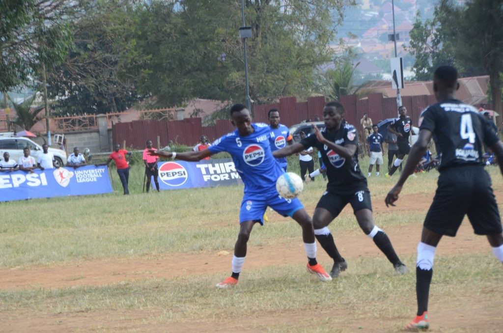 Ssenyonjo Nicholas shielding the ball from MUST’s Nankunda Christopher.