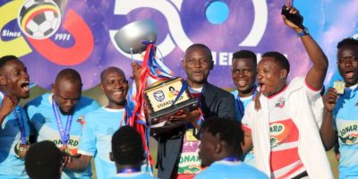 Deo Kasozi celebrates winning the Uganda Cup with his players during his time as club president (courtesy photo).
