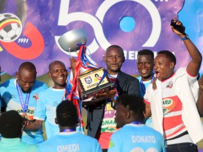 Deo Kasozi celebrates winning the Uganda Cup with his players during his time as club president (courtesy photo).